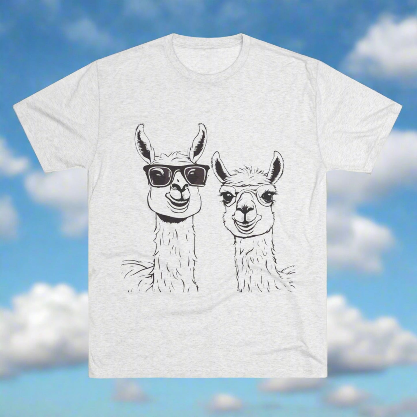 The Printify Llamas - Tri-Blend Crew Tee - Unisex Fit is a light gray t-shirt featuring a black and white illustration of two llamas. One llama is wearing sunglasses while the other is not. Both llamas, facing forward with content expressions, are printed on this premium blend fabric for ultimate comfort and style.