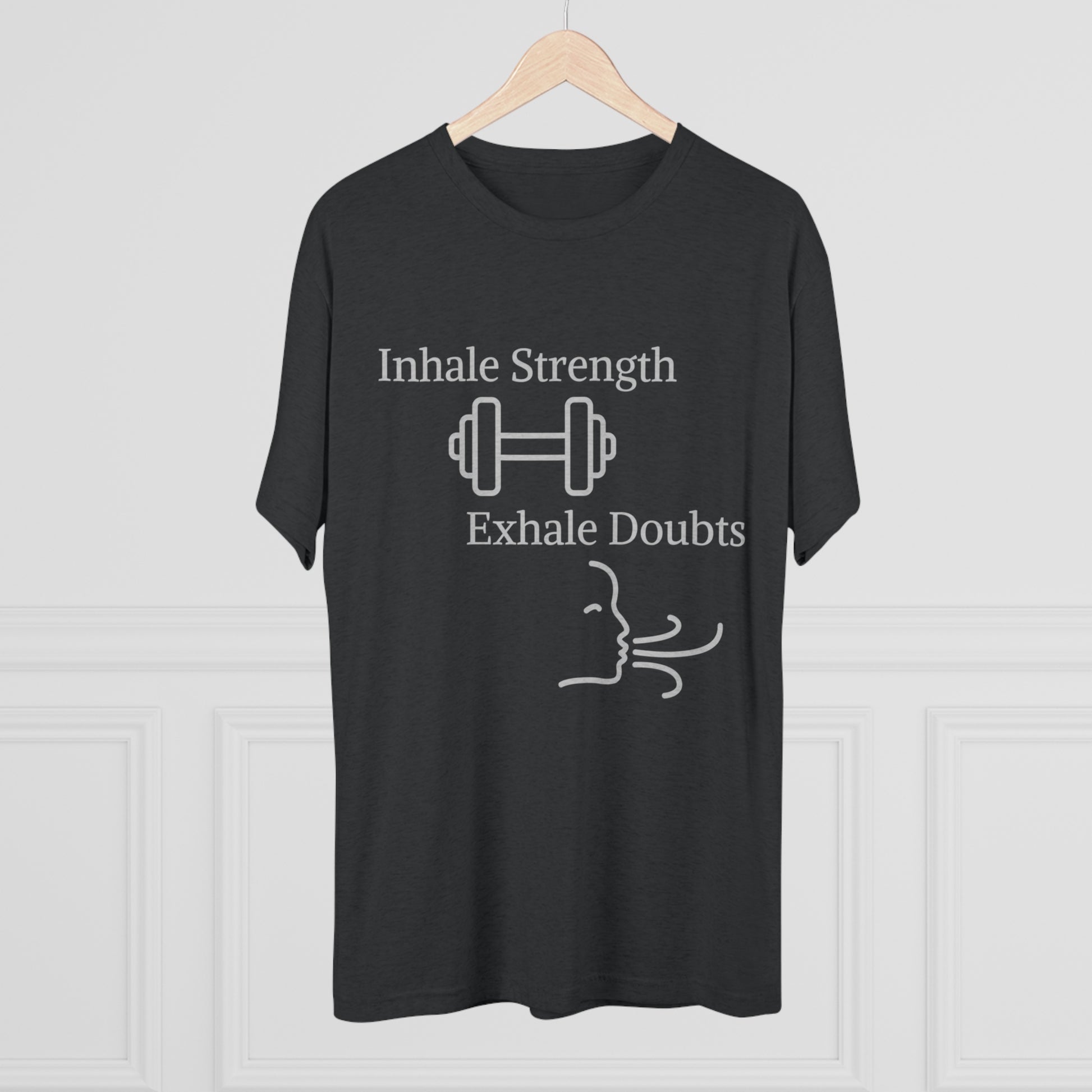 Printify's "Inhale Strength Exhale Doubt w Images" unisex tri-blend crew tee featuring black t-shirt with white text, a dumbbell image, and a stylized face exhaling.